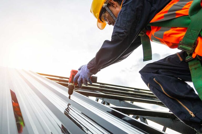 Homeowner examining roof shingles and attic rafters with a flashlight and inspection checklist KEYWORDS: ["roof inspection", "homeowner attic inspection", "roof shingles and gutters"]